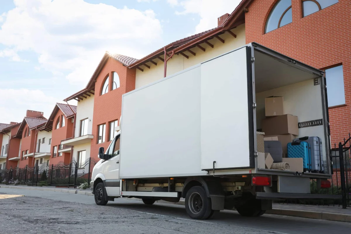 Moving truck loaded outside a home